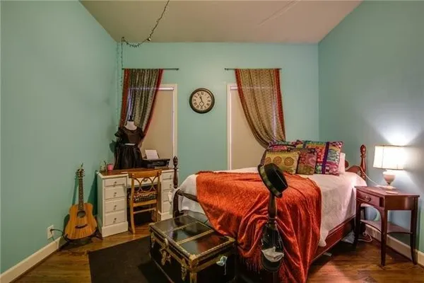 a bed room with a bed and a chair