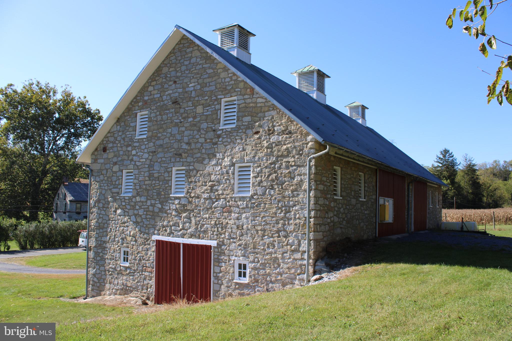 1451 West Leesport Road Leesport, PA 19533 - Photo 5 of 11 a brick house with a yard