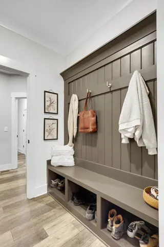 a living room with furniture and a painting on the wall