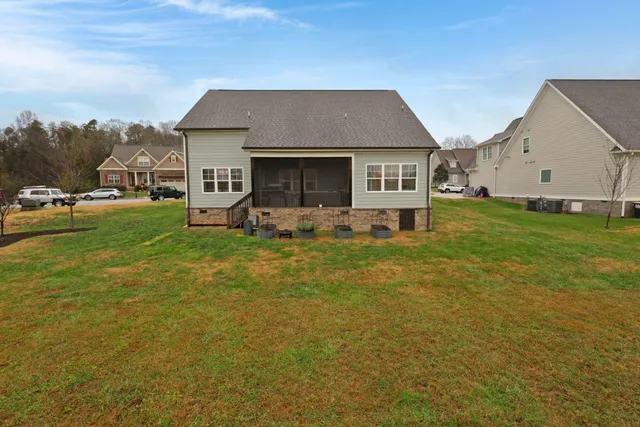 an aerial view of a house with swimming pool and mountain view