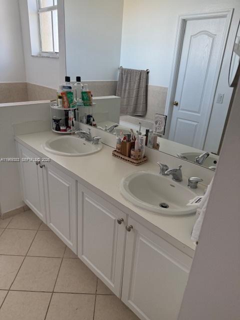 15243 Southwest 9th Way Miami, FL 33194 - Photo 11 of 14 a bathroom with a sink and a mirror