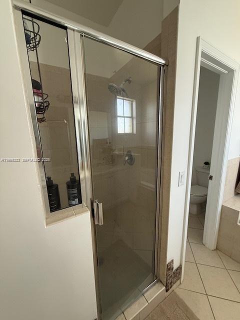 15243 Southwest 9th Way Miami, FL 33194 - Photo 13 of 14 a bathroom with a shower and a mirror