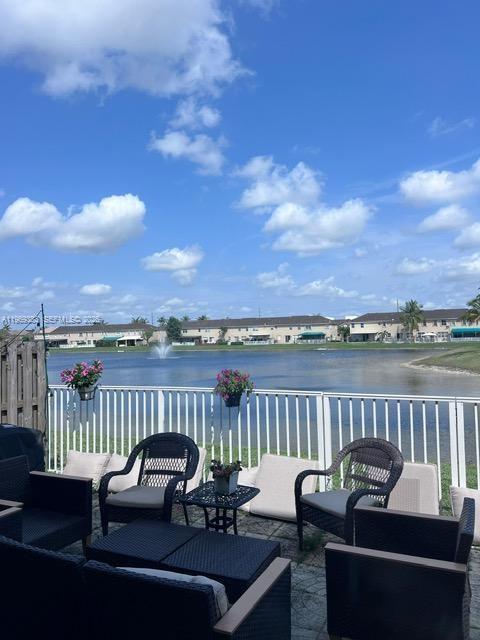 15243 Southwest 9th Way Miami, FL 33194 - Photo 14 of 14 a view of a patio with couches chairs and a table