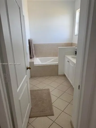 a bathroom with a bathtub sink and toilet