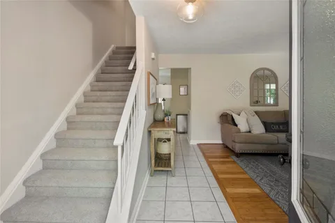 a lobby with furniture and a rug
