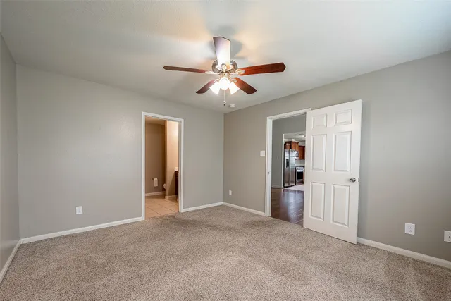 a view of an empty room and fire place