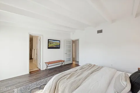 a bathroom with a double vanity sink a mirror and a shower