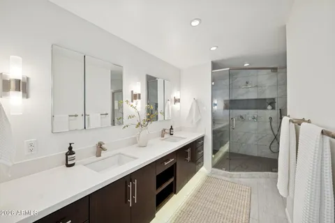 a bathroom with a sink a vanity and a mirror