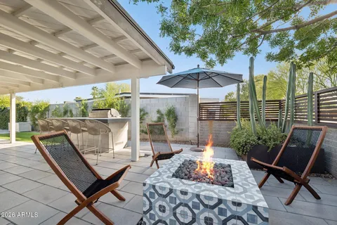 a front view of a house with a garden and plants