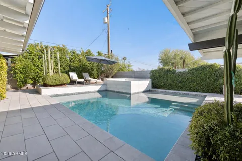 a wooden box filled with plants and flowers