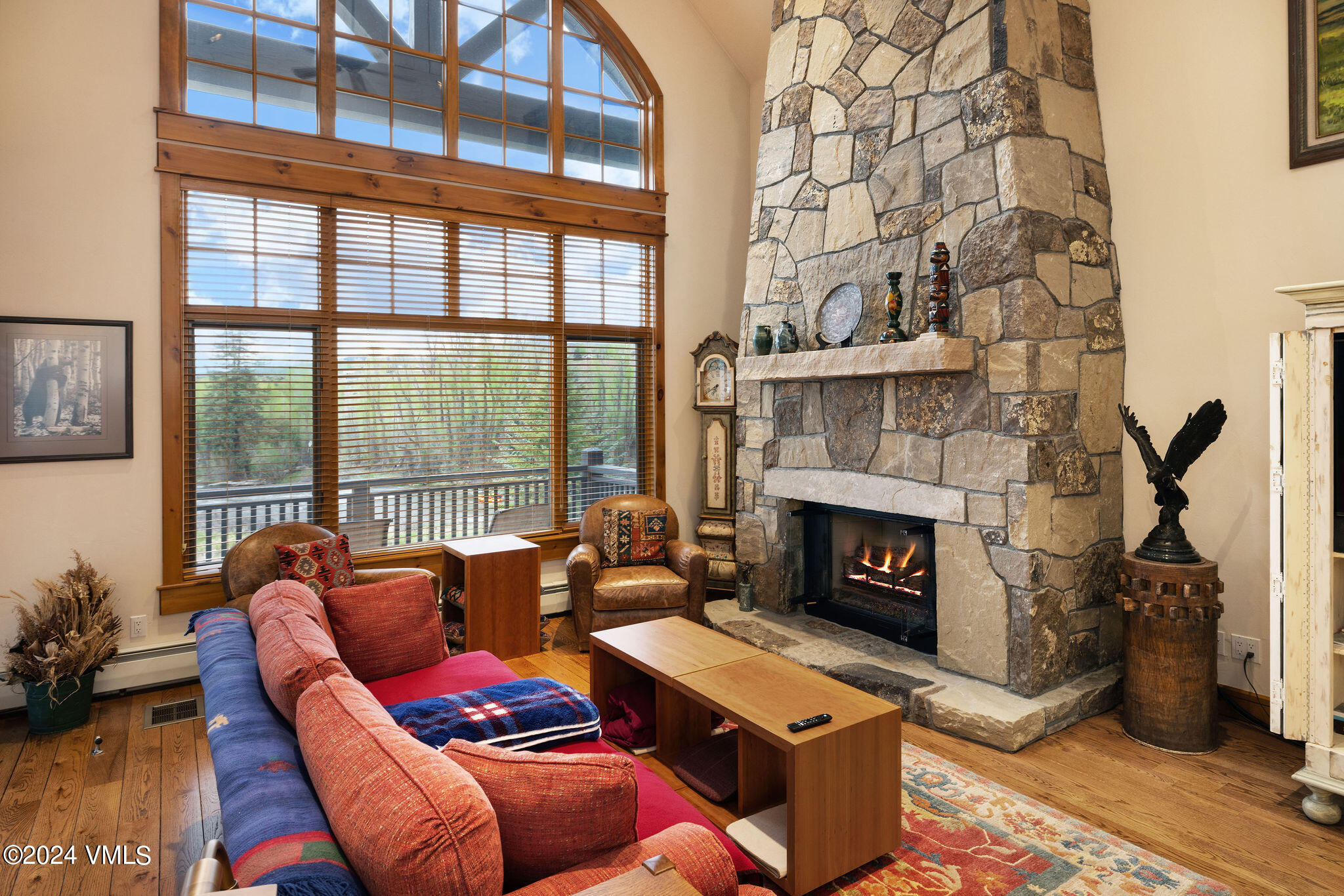 162 River Dance Road Edwards, CO 81632 - Photo 11 of 23 a living room with furniture a fireplace and a floor to ceiling window