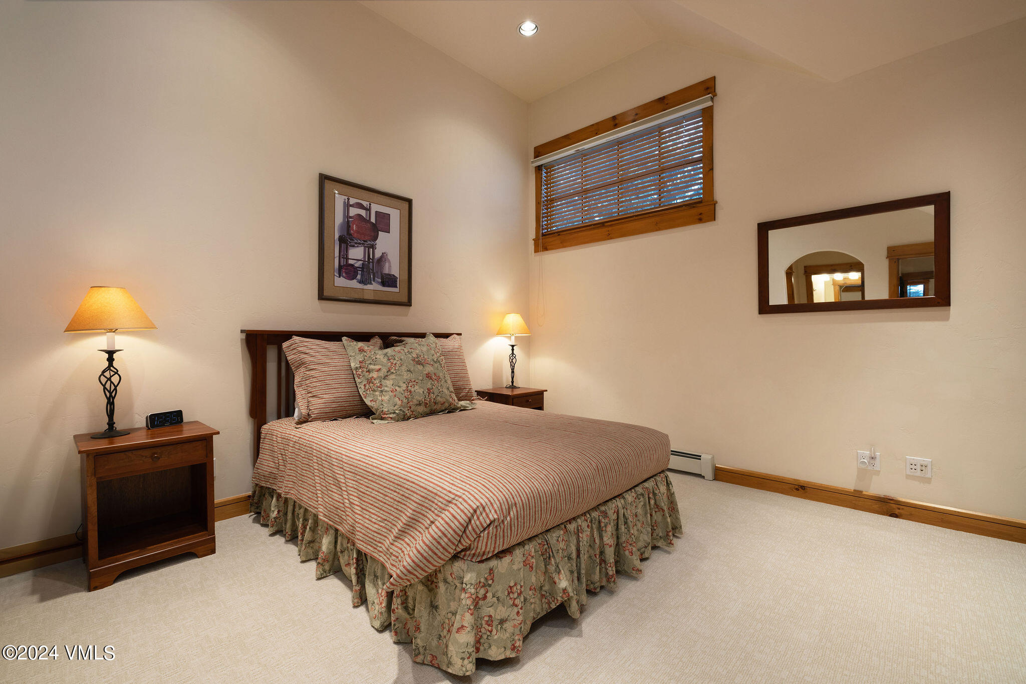 162 River Dance Road Edwards, CO 81632 - Photo 14 of 23 a bedroom with a bed and a lamp on dresser