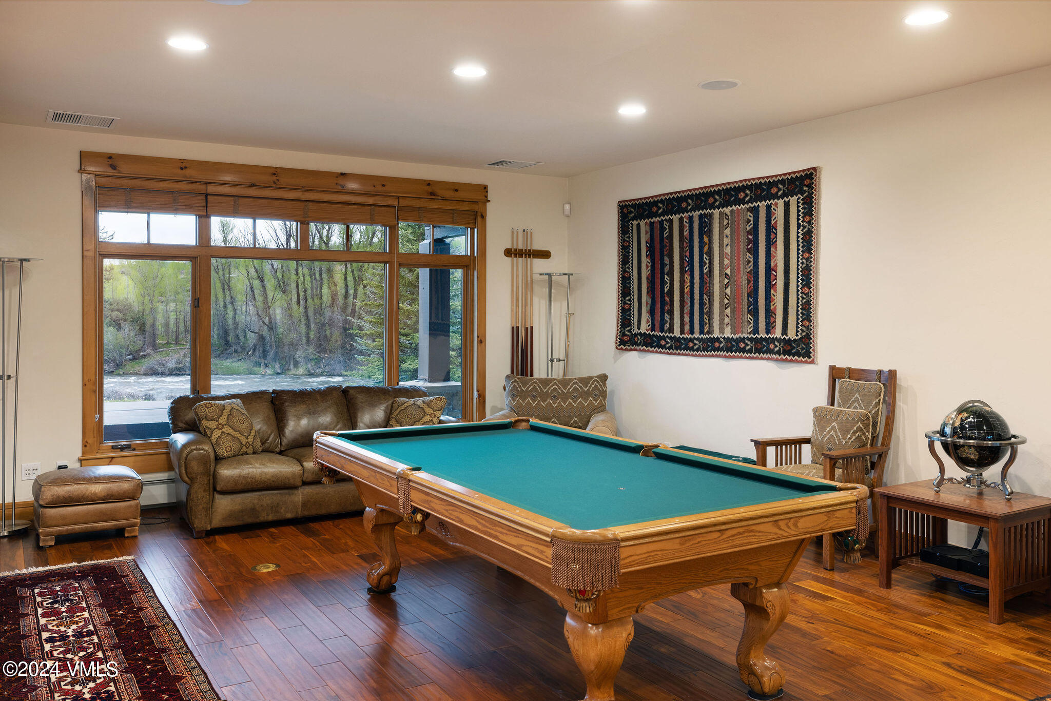 162 River Dance Road Edwards, CO 81632 - Photo 18 of 23 a living room with furniture pool table and a large window