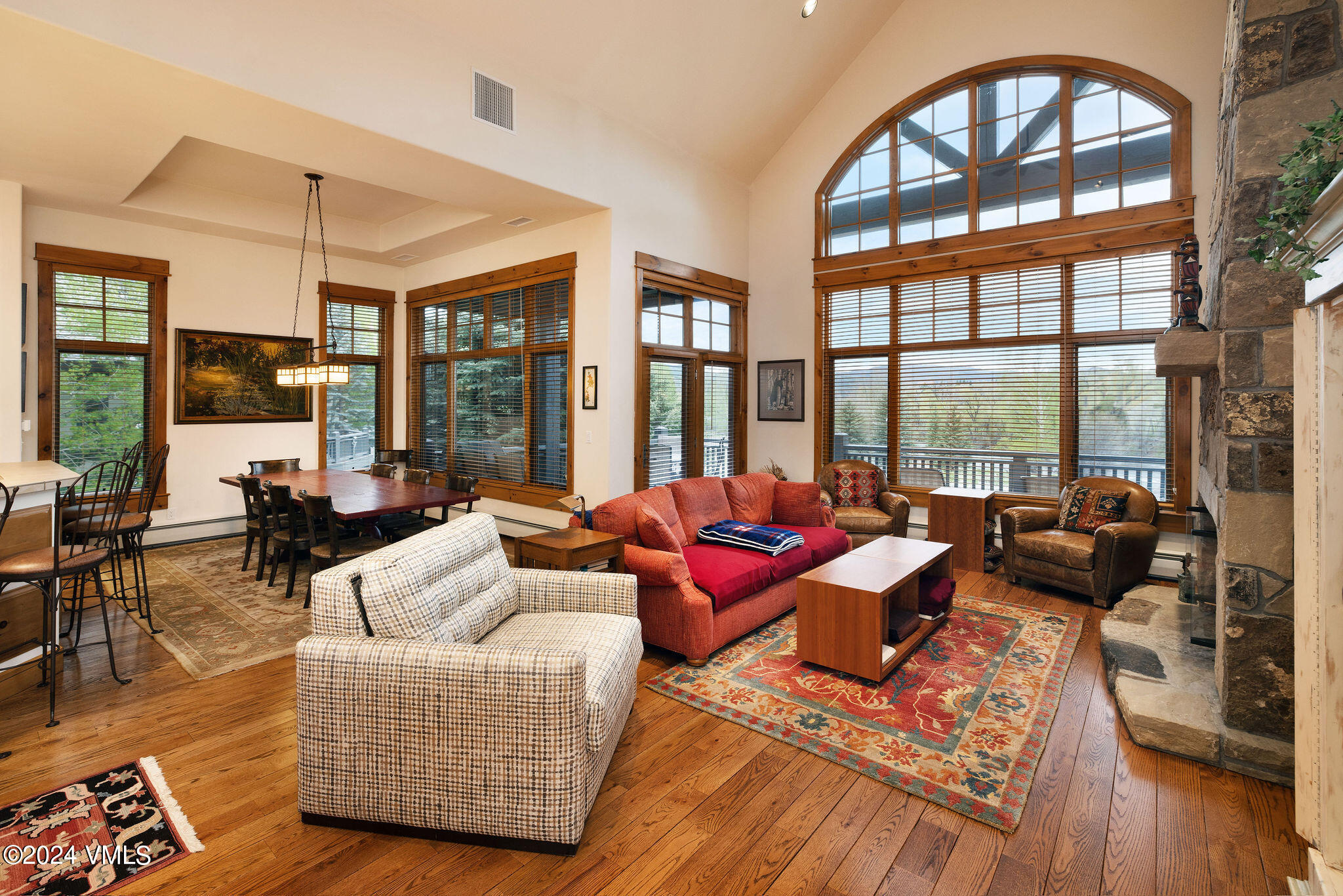 162 River Dance Road Edwards, CO 81632 - Photo 4 of 23 a living room with furniture and floor to ceiling windows