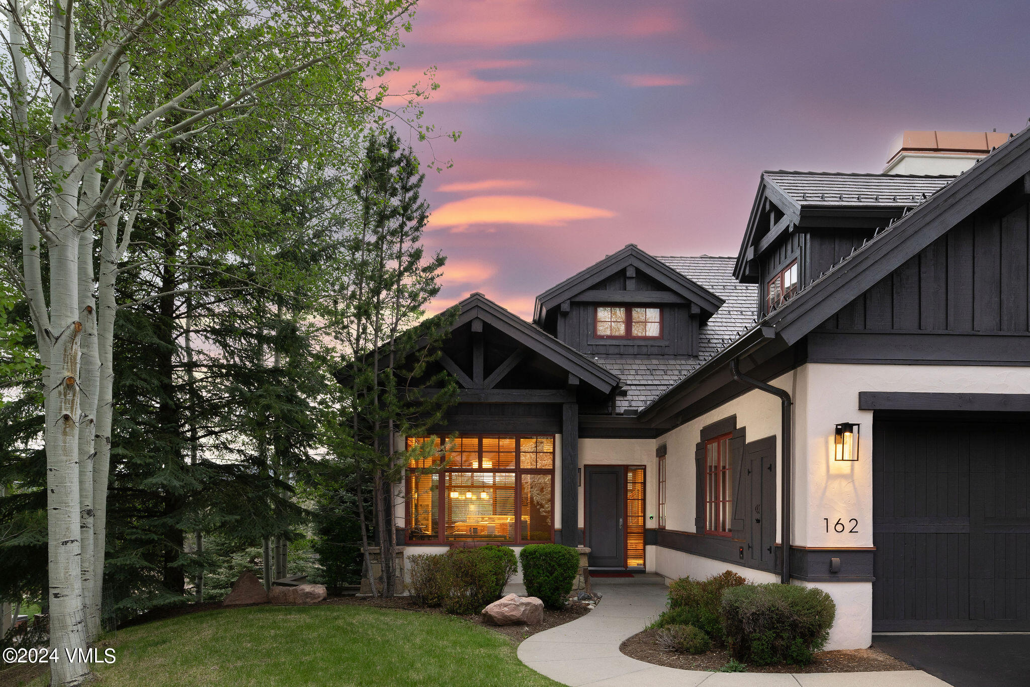 162 River Dance Road Edwards, CO 81632 - Photo 6 of 23 a front view of a house with garden