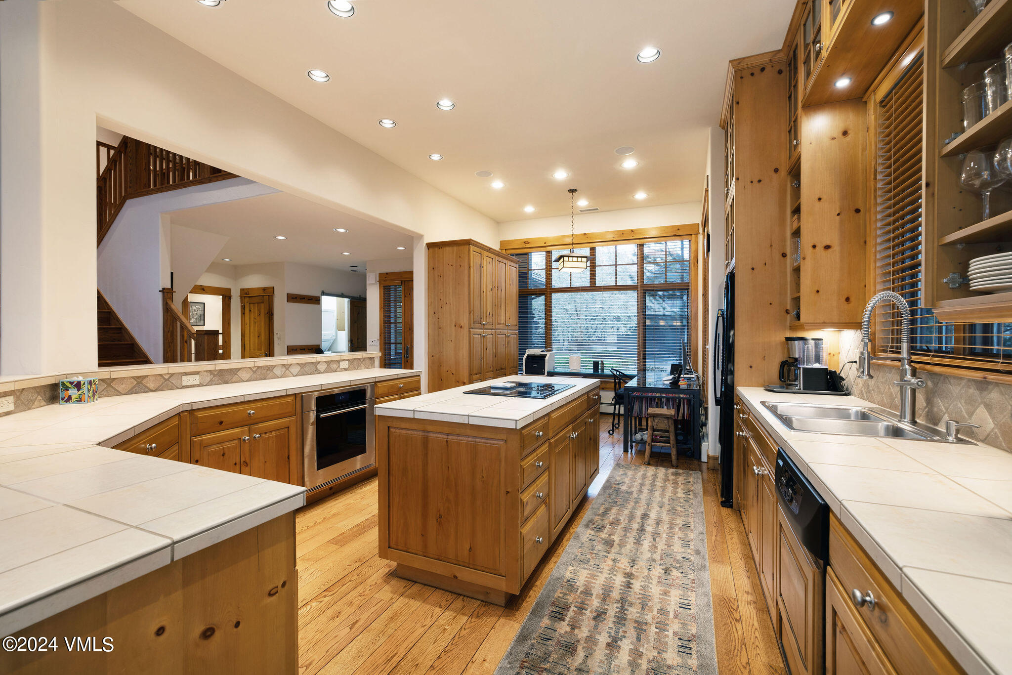 162 River Dance Road Edwards, CO 81632 - Photo 9 of 23 a kitchen with stainless steel appliances granite countertop a sink and a refrigerator