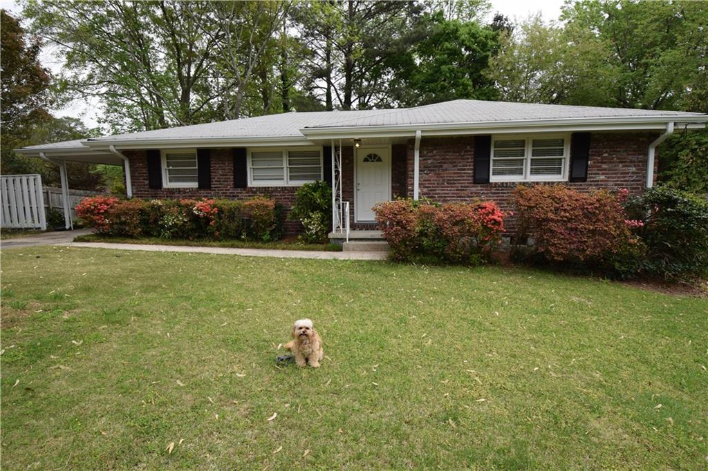 1179 Larch Lane Decatur, GA 30033 - Photo 1 of 1 a front view of house with yard and green space