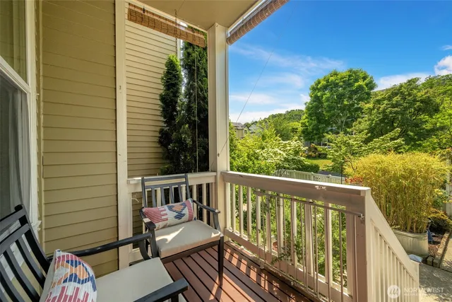a view of a balcony with wooden floor