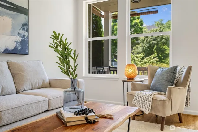 a living room with furniture and a potted plant