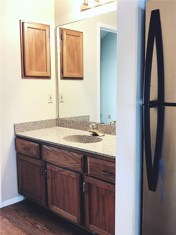 2210 Pearl Street, Unit 304 Austin, TX 78705 - Photo 21 of 32 a bathroom with a granite countertop sink and a mirror