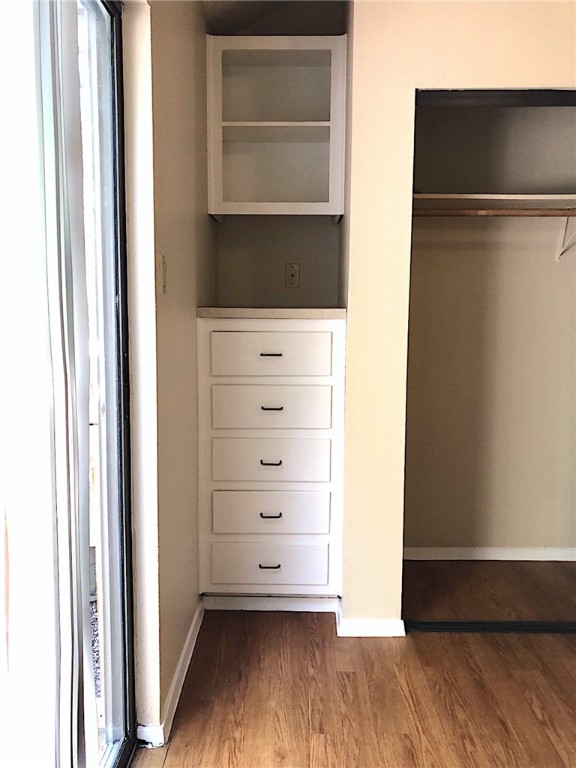 2210 Pearl Street, Unit 304 Austin, TX 78705 - Photo 24 of 32 a view of walk in closet with empty racks