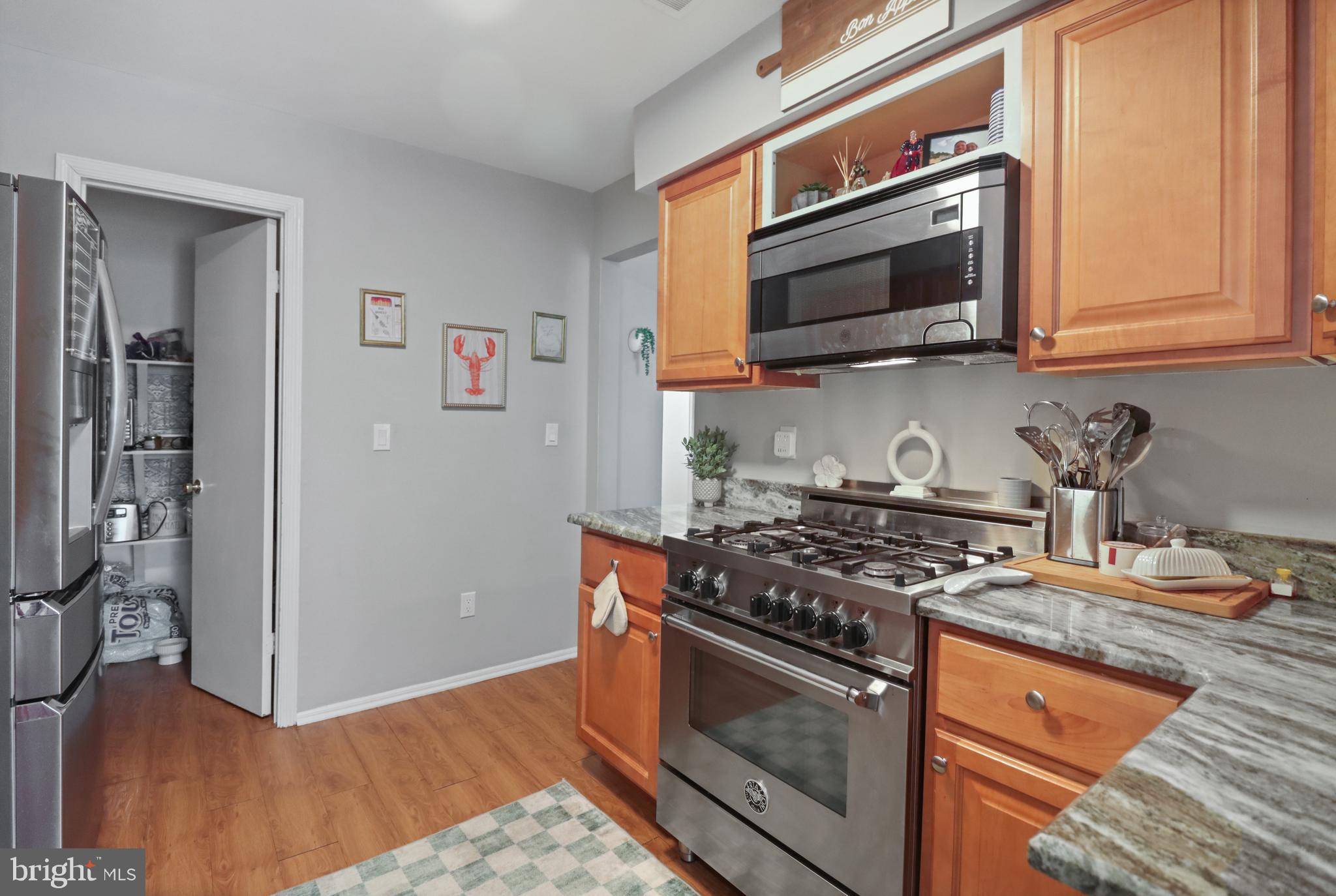8 Bayleaf Drive Lumberton, NJ 08048 - Photo 20 of 53 a kitchen with stainless steel appliances granite countertop a stove and a microwave