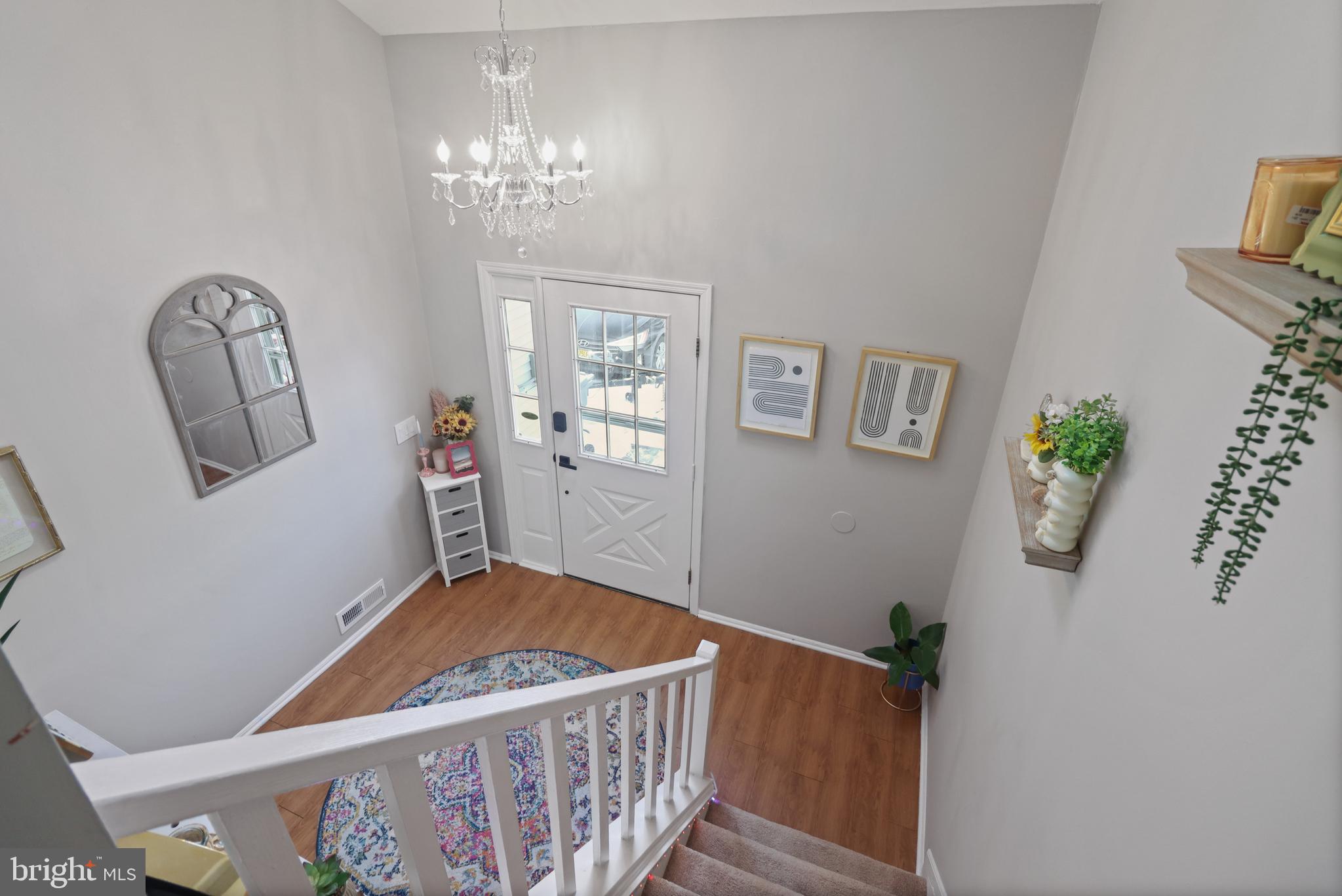 8 Bayleaf Drive Lumberton, NJ 08048 - Photo 31 of 53 a bedroom with a bed and a chandelier