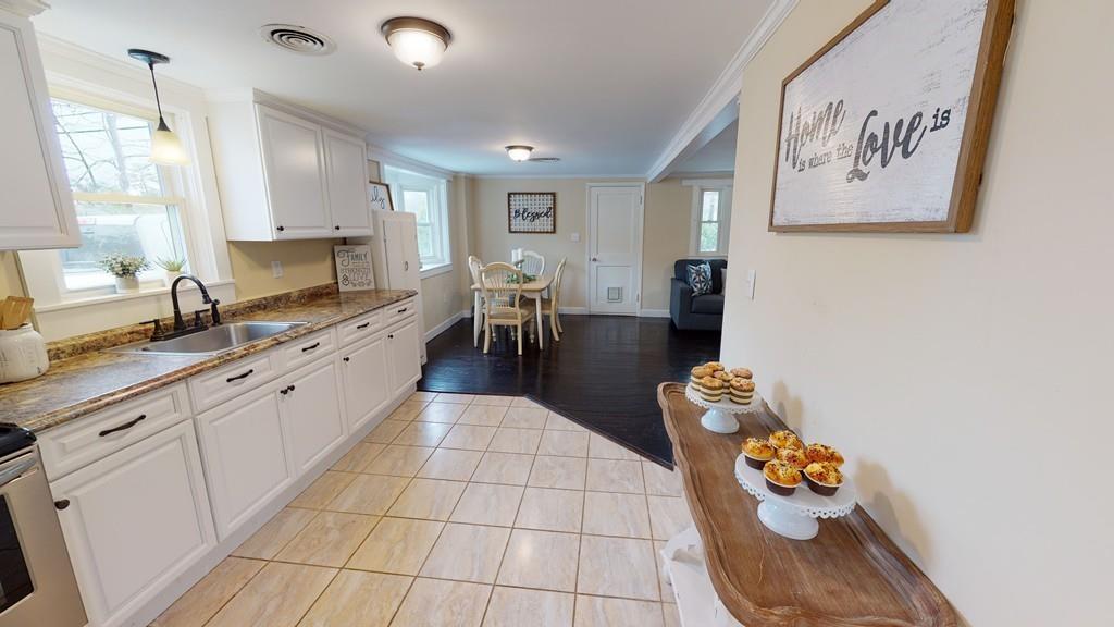 23 Middleboro Road Freetown, MA 02717 - Photo 17 of 30 a large white kitchen with a sink and cabinets