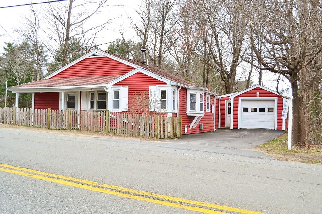 23 Middleboro Road Freetown, MA 02717 - Photo 2 of 30 a front view of a house with a yard and garage