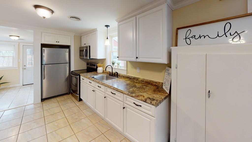 23 Middleboro Road Freetown, MA 02717 - Photo 24 of 30 a kitchen with granite countertop a sink appliances and cabinets