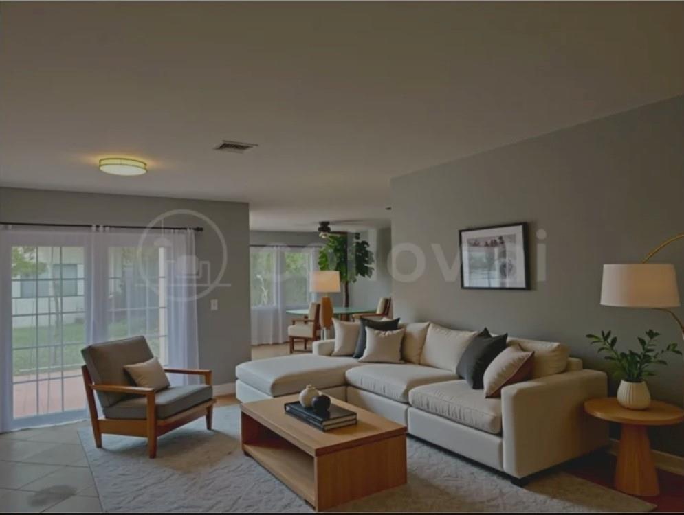 4151 Eastridge Circle Deerfield Beach, FL 33064 - Photo 16 of 53 a living room with furniture and a large window