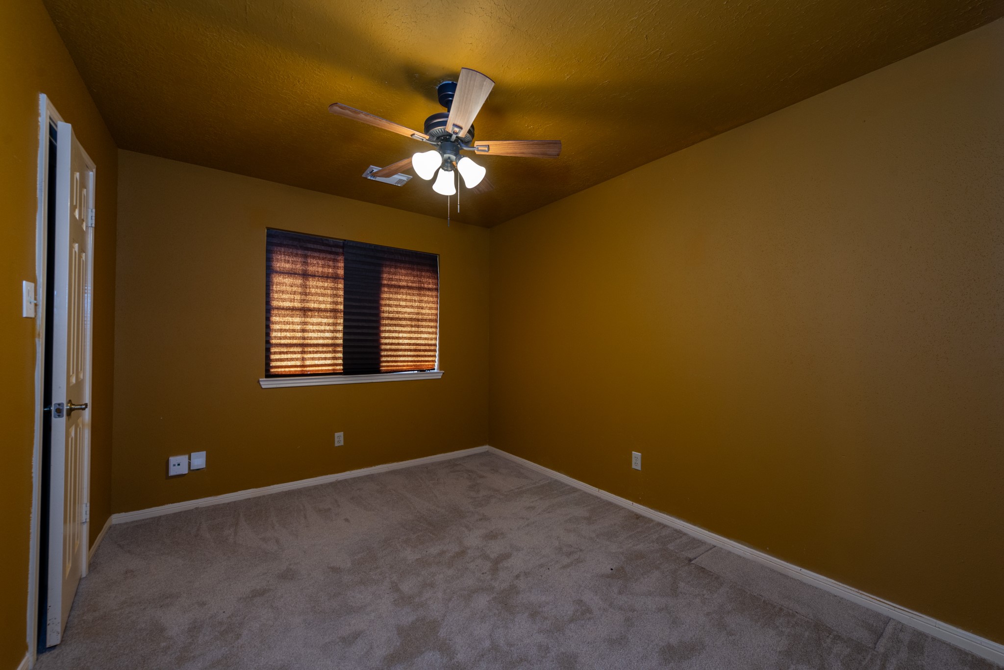 12203 Canterhurst Way Houston, TX 77065 - Photo 11 of 23 a view of a livingroom with a ceiling fan and window