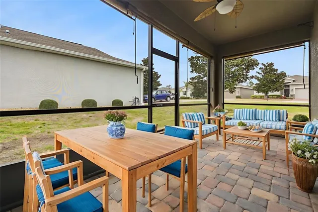 a view of a dining room with furniture large window and outside view