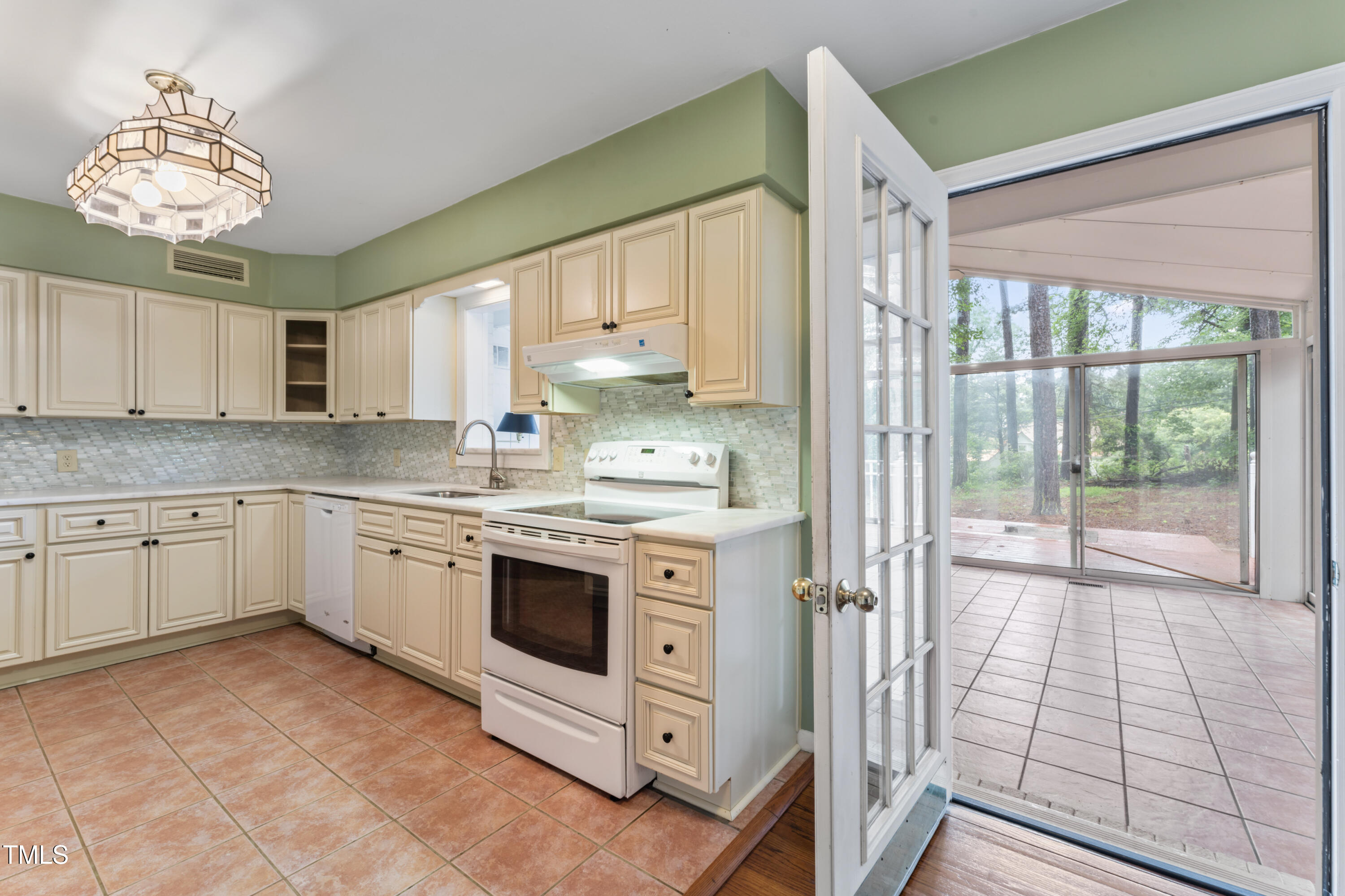 3872 Hope Valley Road Durham, NC 27707 - Photo 23 of 49 a kitchen with stainless steel appliances granite countertop a stove a sink and a refrigerator
