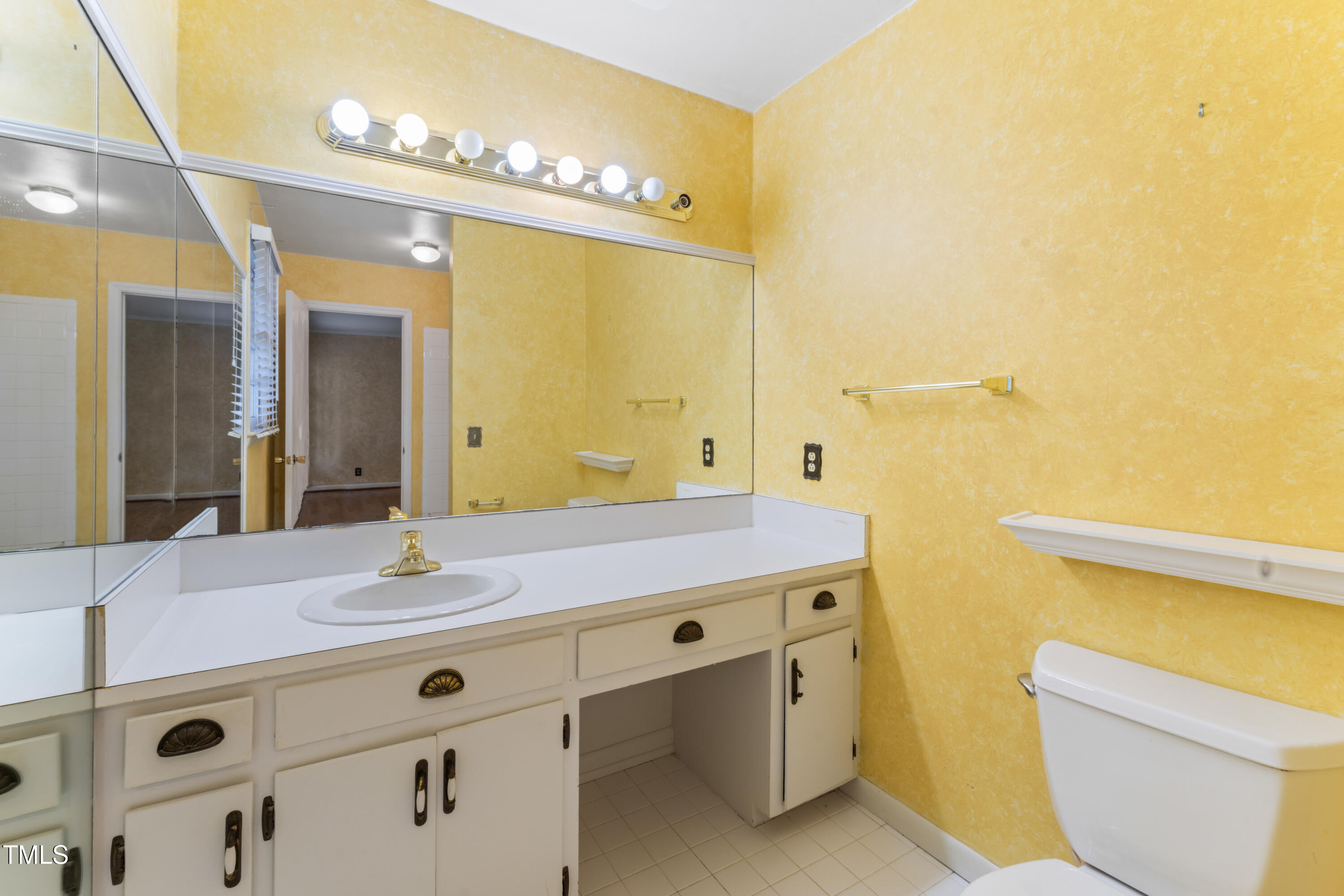 3872 Hope Valley Road Durham, NC 27707 - Photo 34 of 49 a bathroom with a granite countertop sink and a mirror