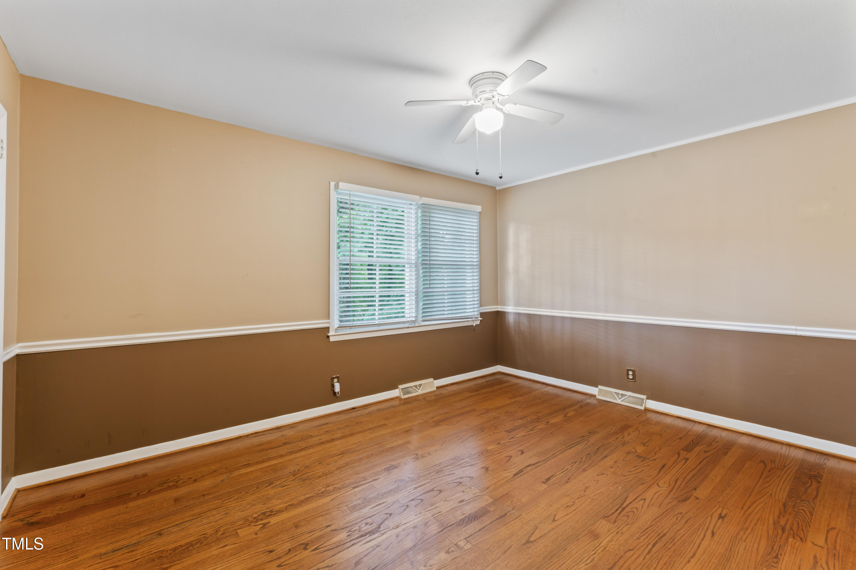 3872 Hope Valley Road Durham, NC 27707 - Photo 37 of 49 a view of a room with wooden floor and fan
