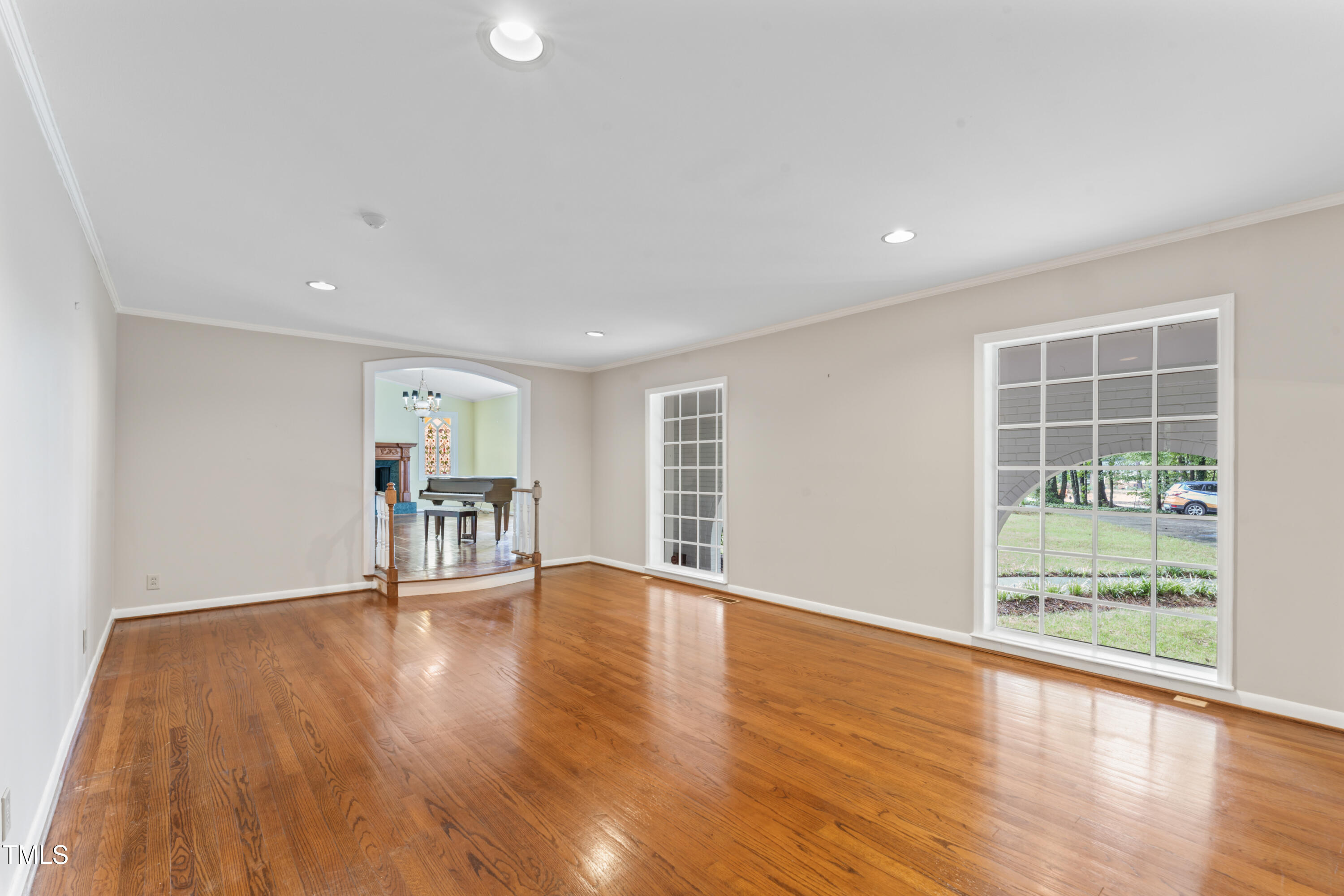 3872 Hope Valley Road Durham, NC 27707 - Photo 9 of 49 a view of an empty room with wooden floor and a window