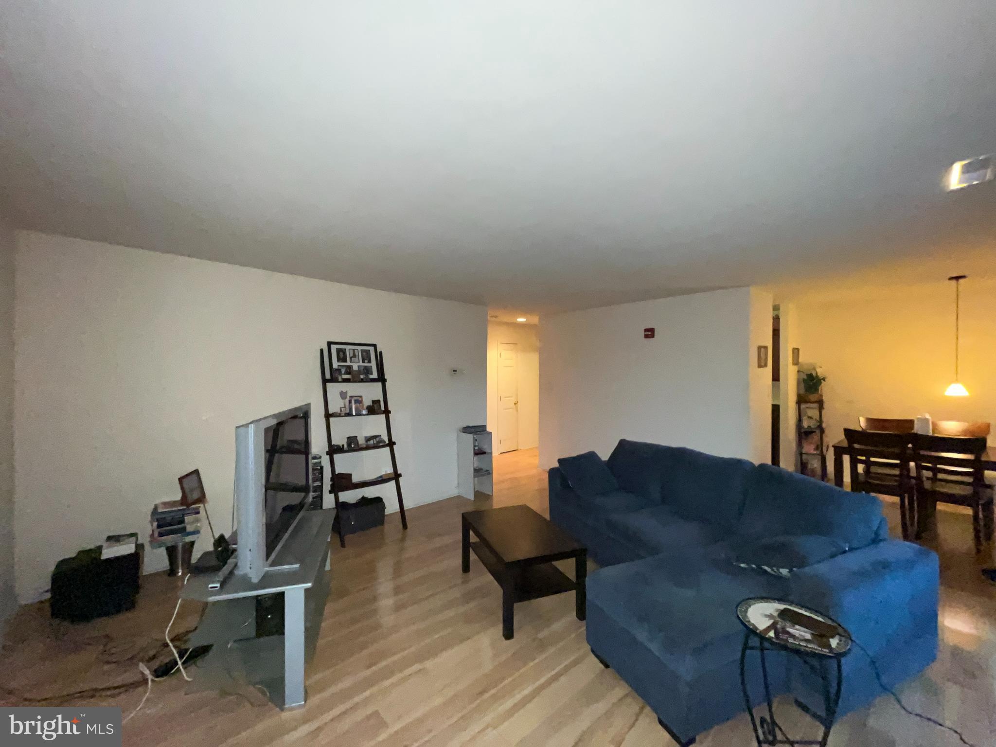 7101 Donnell Place, Unit D8 District Heights, MD 20747 - Photo 19 of 35 a living room with furniture and wooden floor