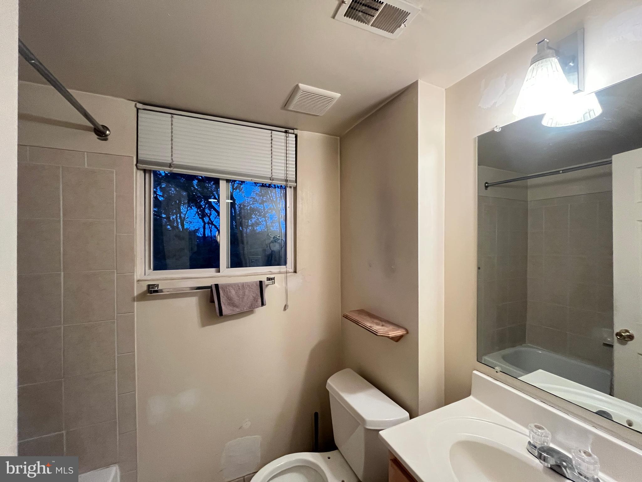 7101 Donnell Place, Unit D8 District Heights, MD 20747 - Photo 29 of 35 a bathroom with a toilet sink and shower