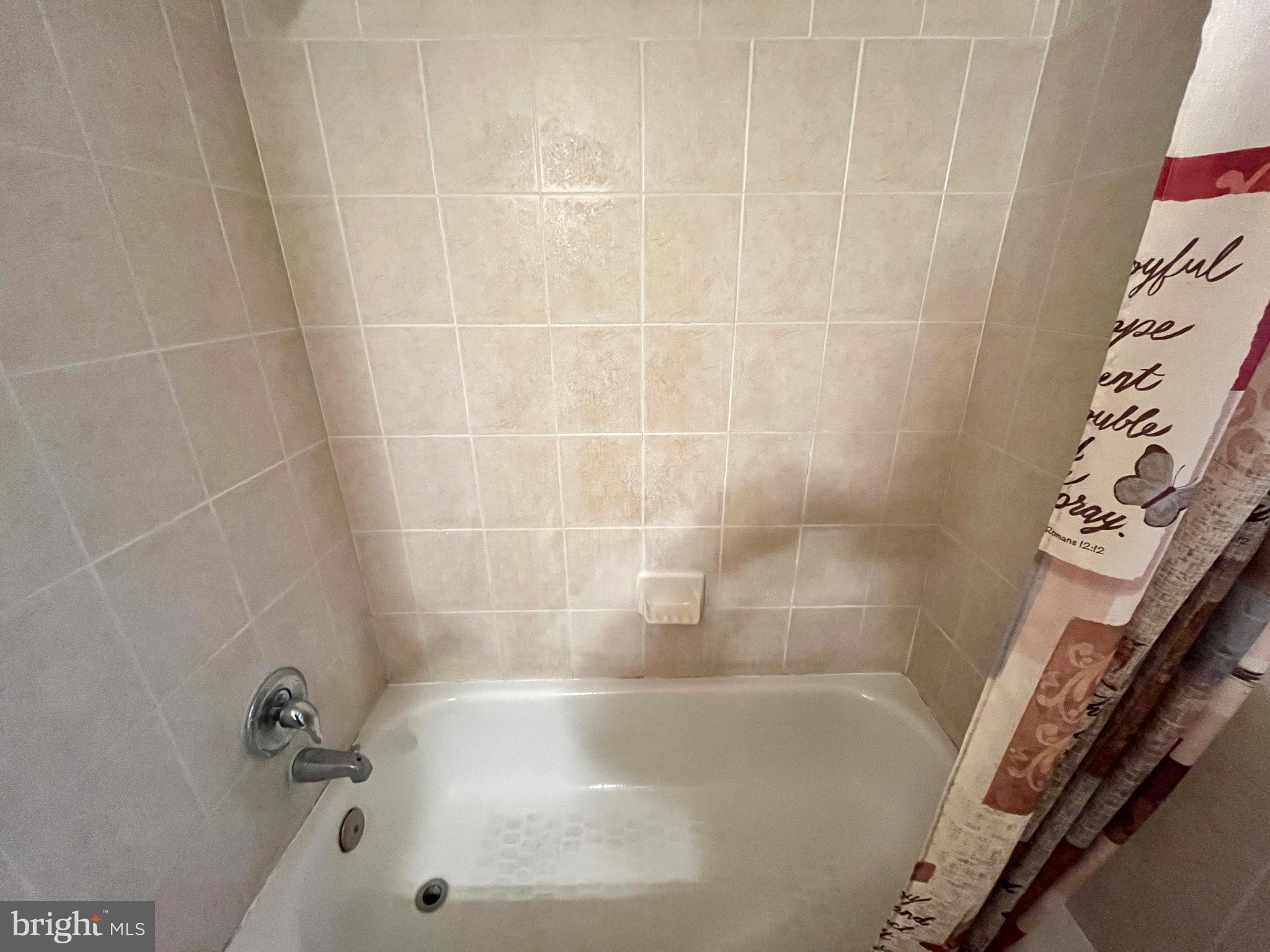 7101 Donnell Place, Unit D8 District Heights, MD 20747 - Photo 30 of 35 a close up of a bathtub