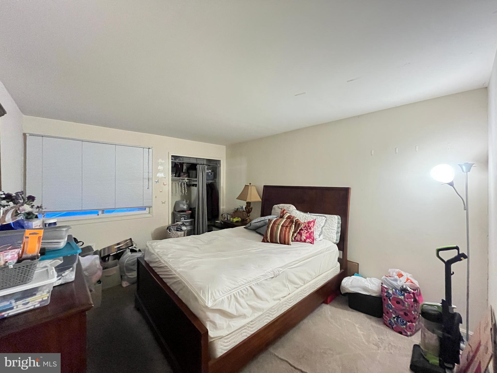 7101 Donnell Place, Unit D8 District Heights, MD 20747 - Photo 32 of 35 a bedroom with a bed and a window