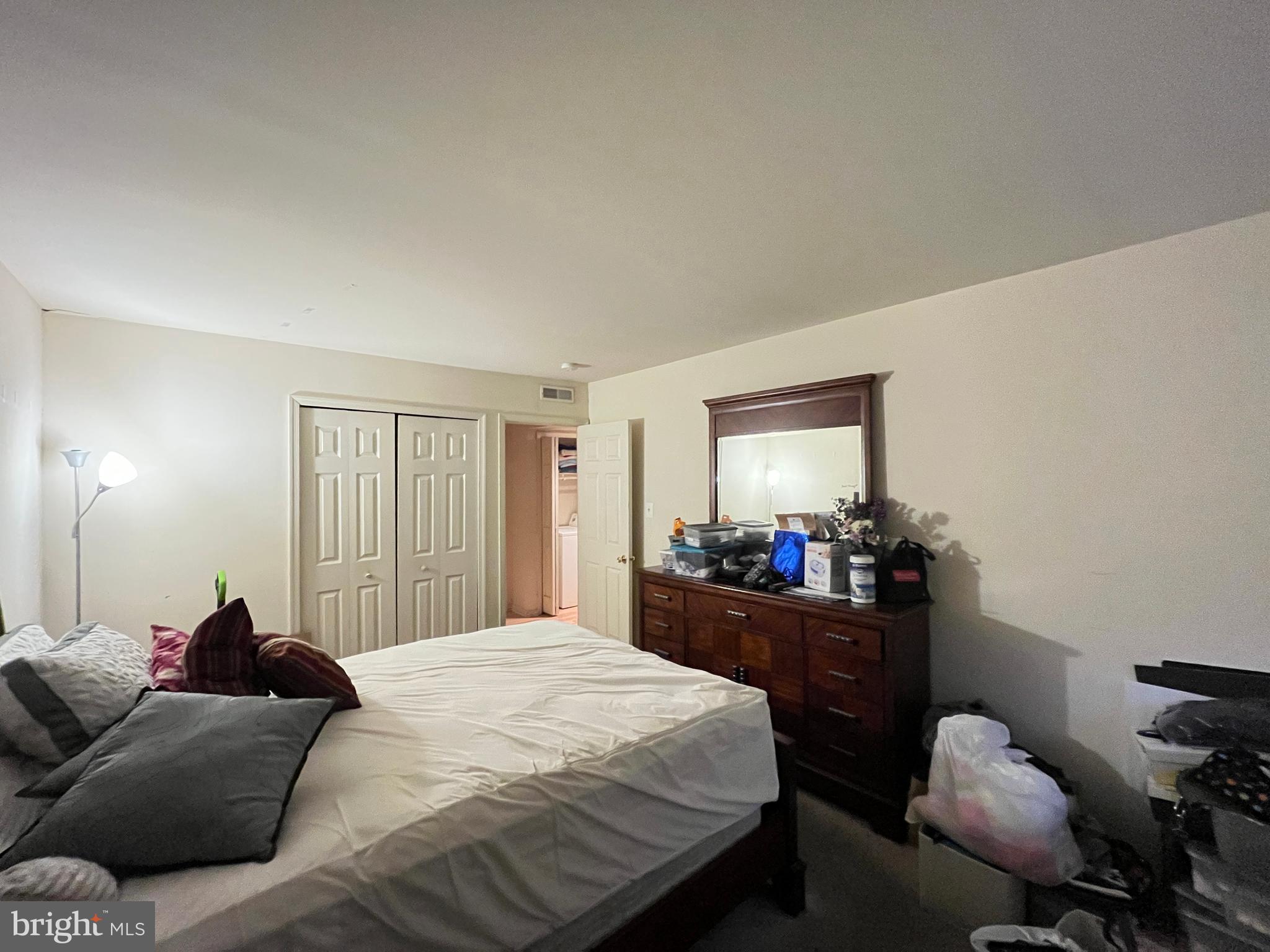 7101 Donnell Place, Unit D8 District Heights, MD 20747 - Photo 33 of 35 a bedroom with a bed and furniture