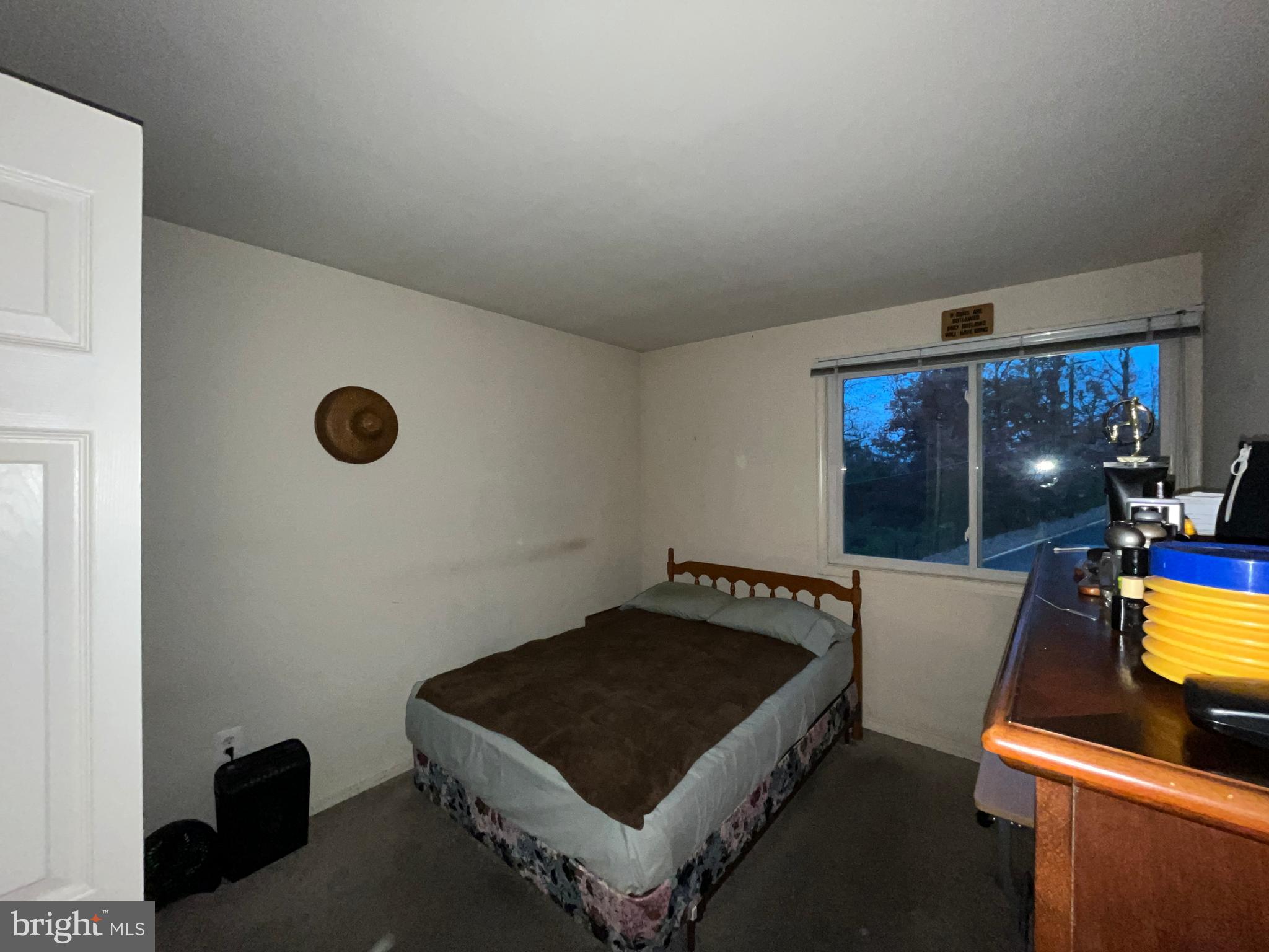 7101 Donnell Place, Unit D8 District Heights, MD 20747 - Photo 34 of 35 a living room with a table and a fireplace