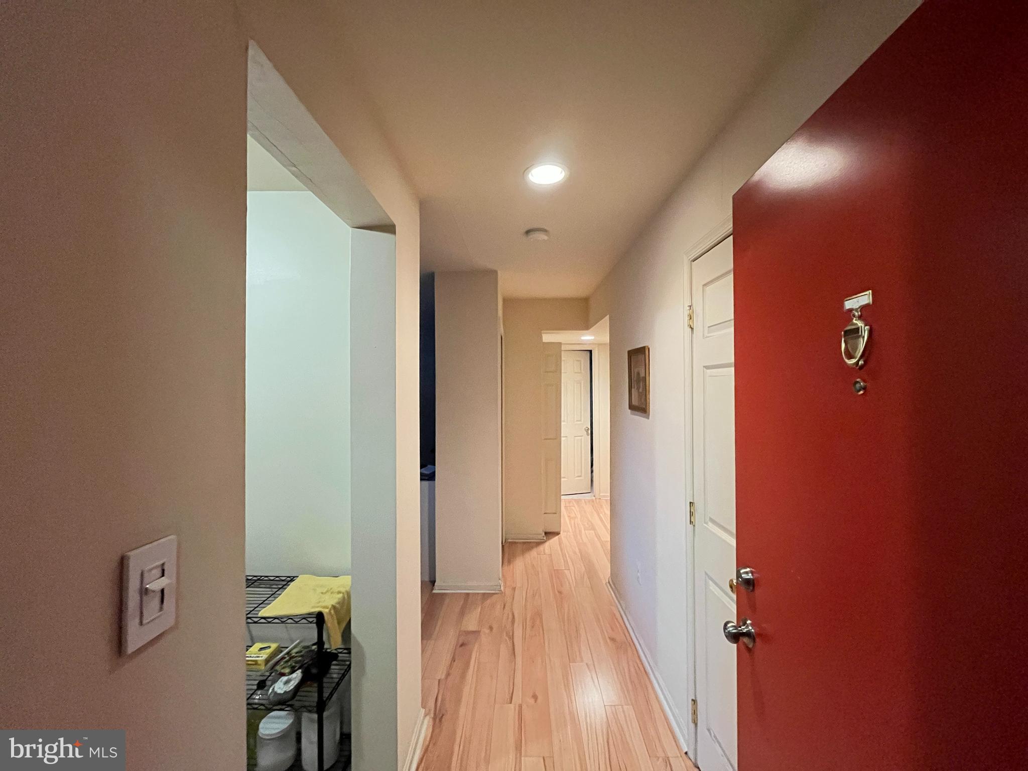 7101 Donnell Place, Unit D8 District Heights, MD 20747 - Photo 9 of 35 a view of a hallway with wooden floor