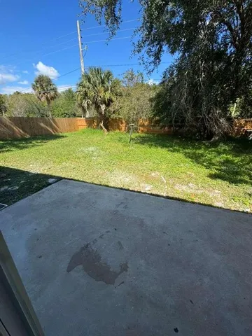 a view of a field with an trees