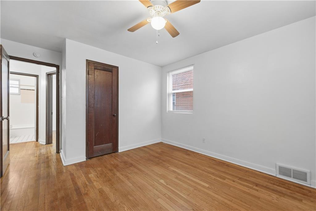 614 Ridgemont Drive Pittsburgh, PA 15220 - Photo 12 of 26 wooden floor in an empty room with a window