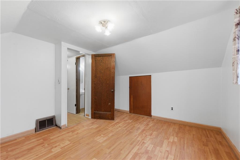 614 Ridgemont Drive Pittsburgh, PA 15220 - Photo 14 of 26 a view of an empty room with wooden floor