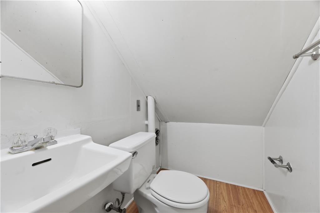 614 Ridgemont Drive Pittsburgh, PA 15220 - Photo 15 of 26 a white toilet sitting next to a bathroom sink