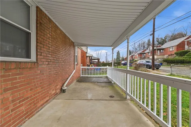 a view of hallway with wooden floor