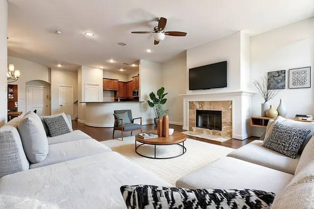 a living room with furniture fireplace and a flat screen tv